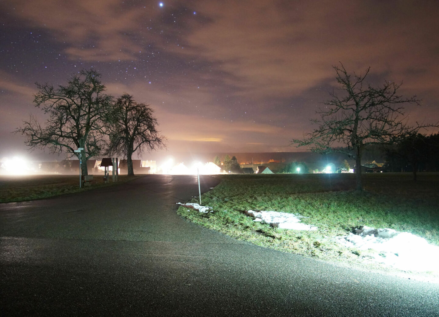 Glare from unshielded lights inhibits the ability to see well at night.