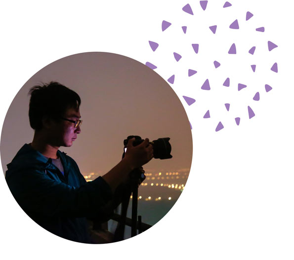 Picture of someone taking a photograph at night.